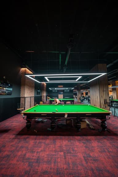 A player at a snooker table